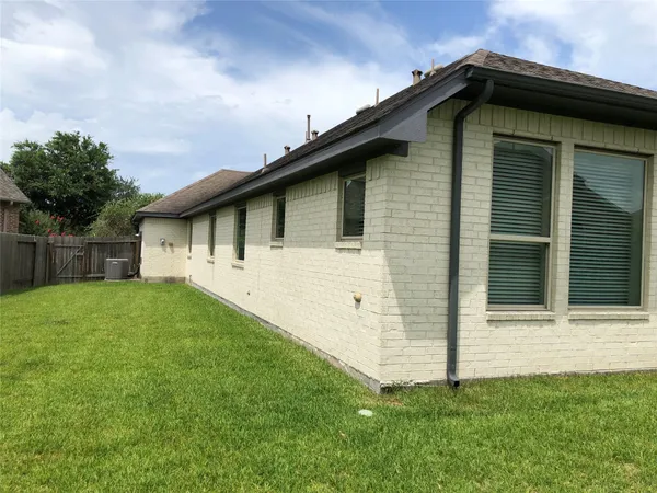 a view of a park with large trees