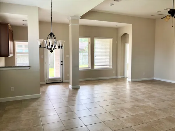 a view of an empty room with glass door