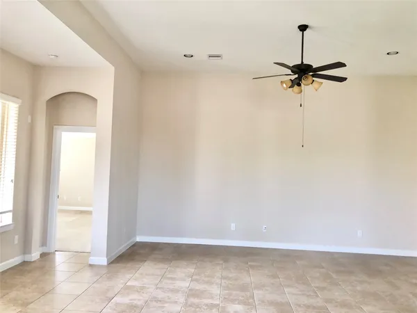 a kitchen with granite countertop a sink a window and stainless steel appliances