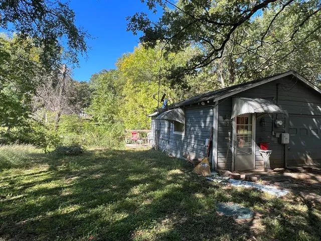 a view of a house with a tree