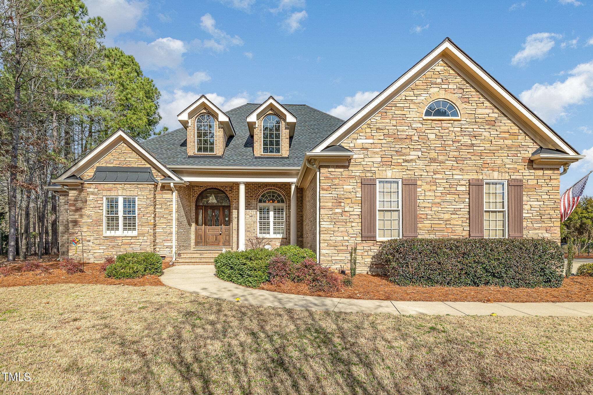 front view of a house with a yard