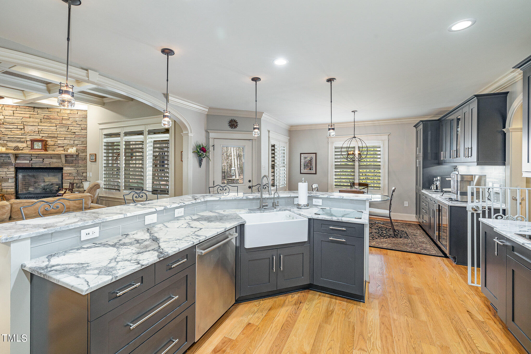 96 Barringer Drive Garner, NC 27529 - Photo 11 of 35 a large kitchen with kitchen island a sink stainless steel appliances and cabinets