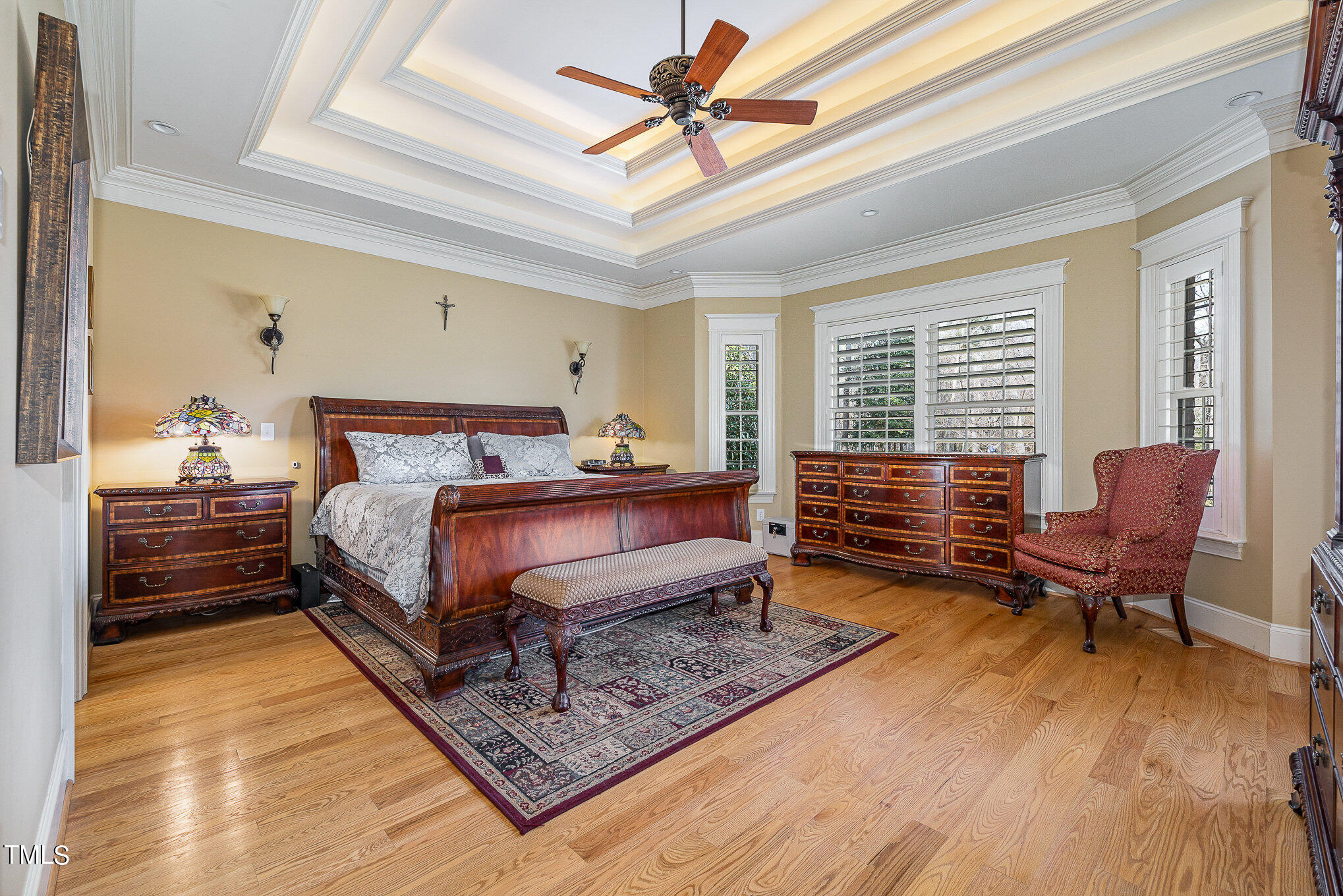 96 Barringer Drive Garner, NC 27529 - Photo 15 of 35 a bedroom with a bed and wooden floor