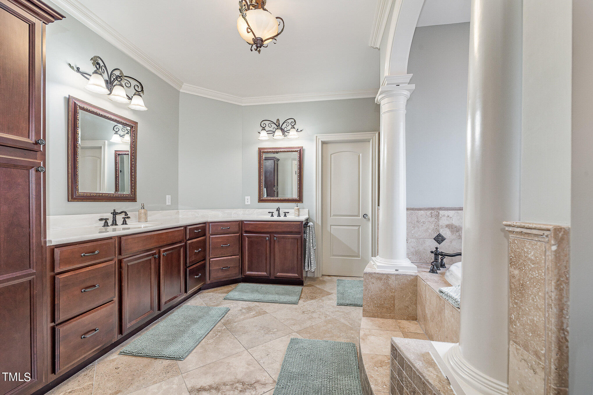 96 Barringer Drive Garner, NC 27529 - Photo 17 of 35 a spacious bathroom with a tub sink and mirror