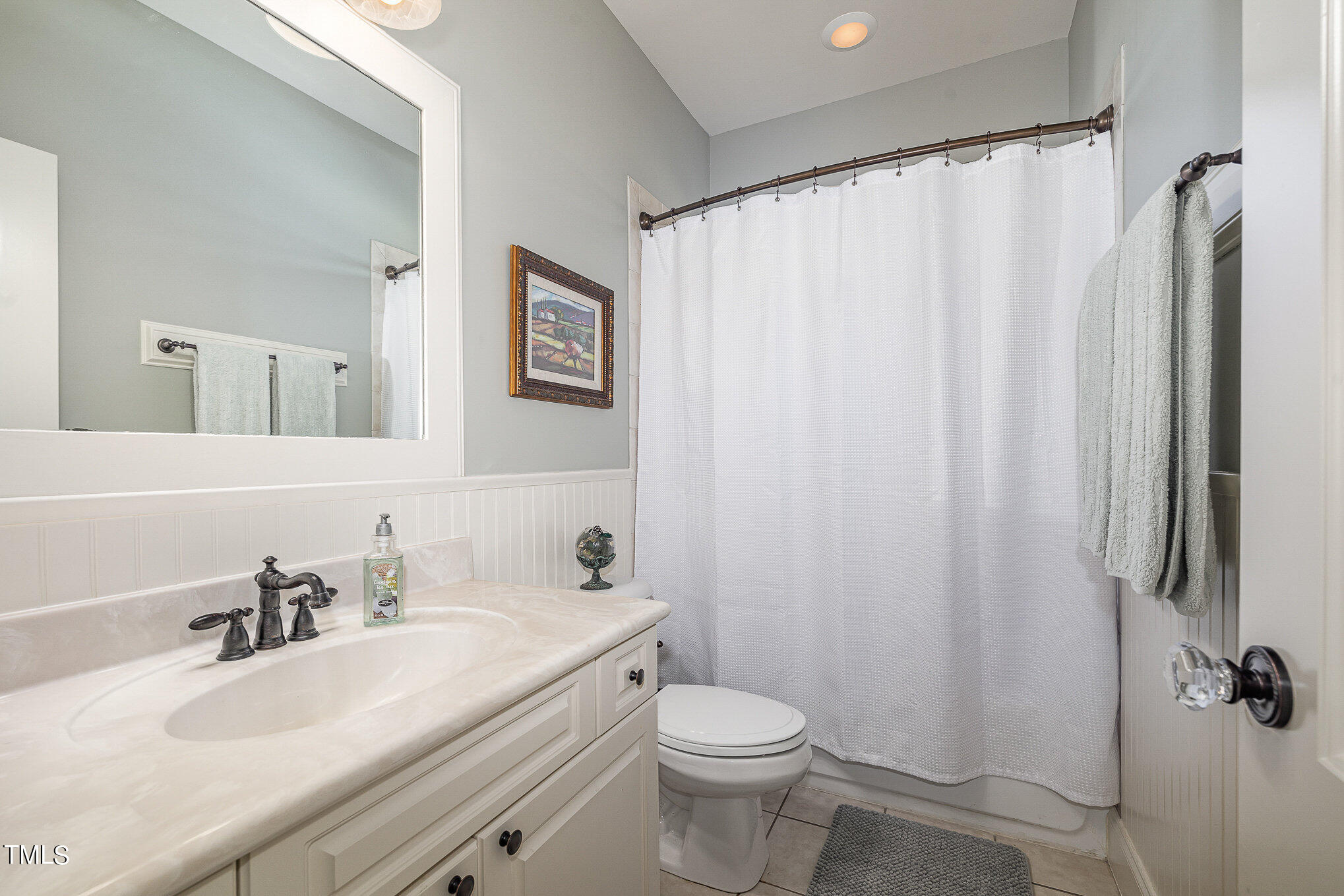 96 Barringer Drive Garner, NC 27529 - Photo 19 of 35 a bathroom with a sink a toilet and a mirror