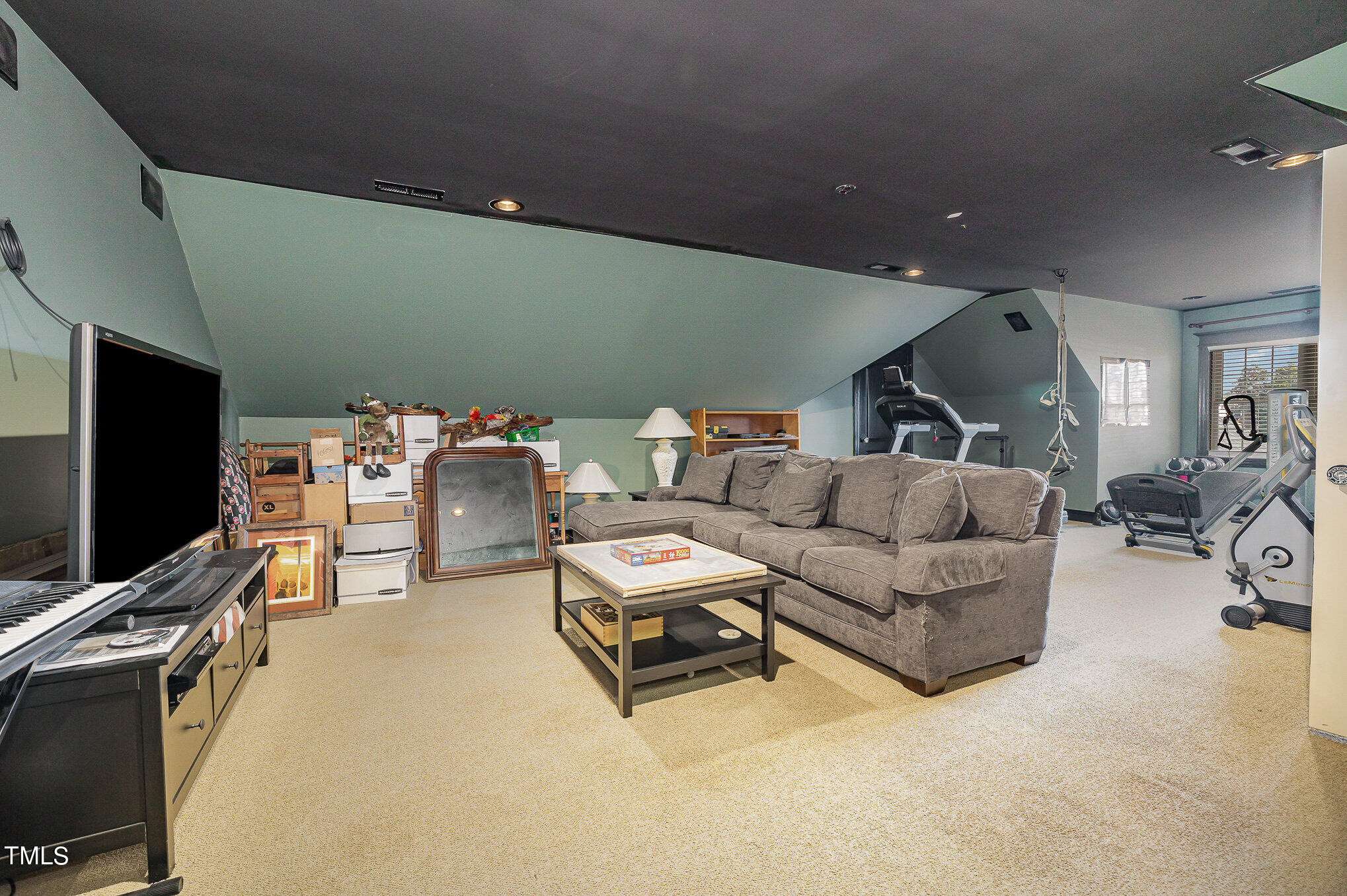 96 Barringer Drive Garner, NC 27529 - Photo 26 of 35 a living room with furniture and a flat screen tv