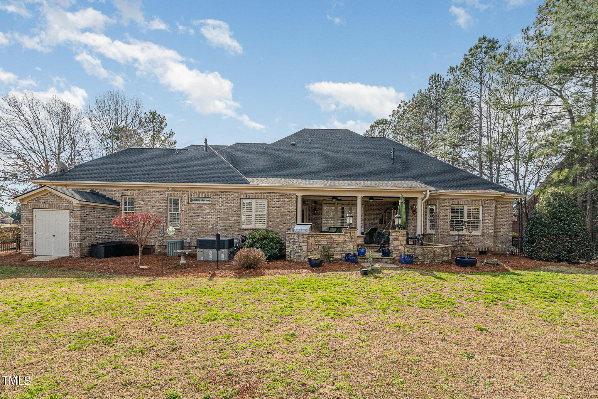 96 Barringer Drive Garner, NC 27529 - Photo 32 of 35 a front view of house with yard and outdoor seating
