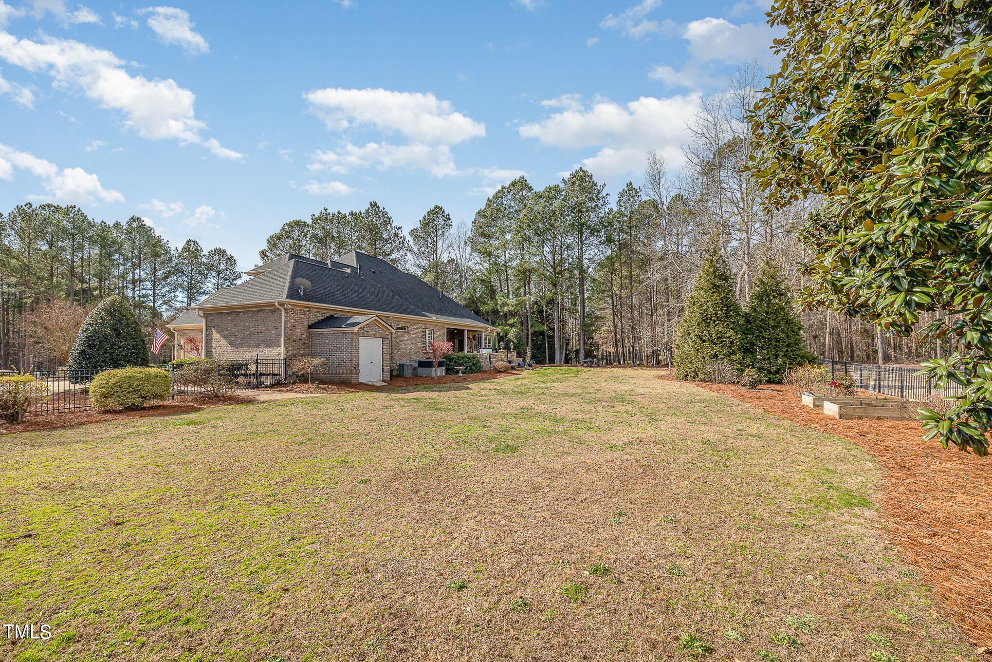 96 Barringer Drive Garner, NC 27529 - Photo 33 of 35 a front view of a house with a yard and trees