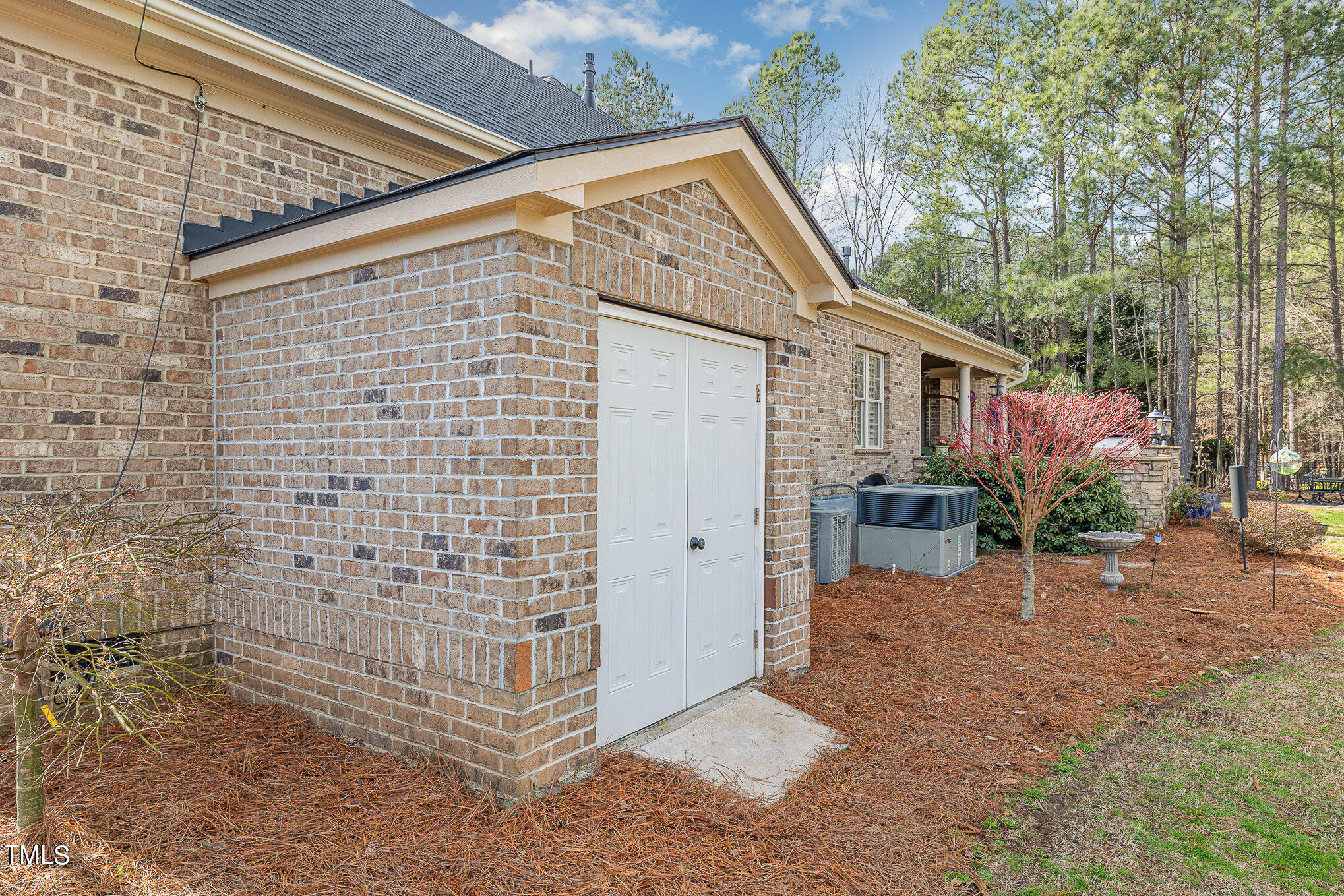 96 Barringer Drive Garner, NC 27529 - Photo 35 of 35 a view of a backyard with plants and a patio