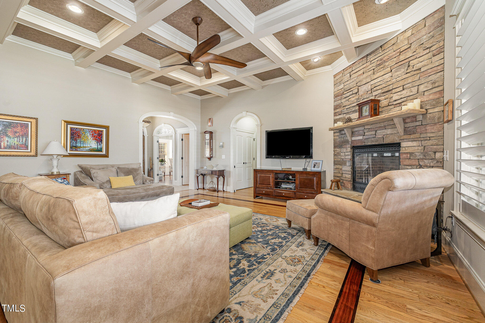 96 Barringer Drive Garner, NC 27529 - Photo 6 of 35 a living room with furniture a flat screen tv and a fireplace