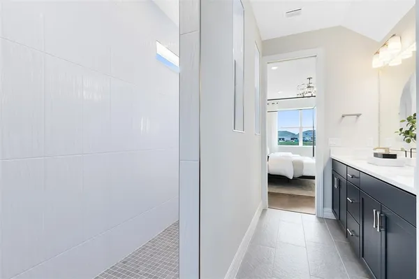 a bathroom with a sink and a window