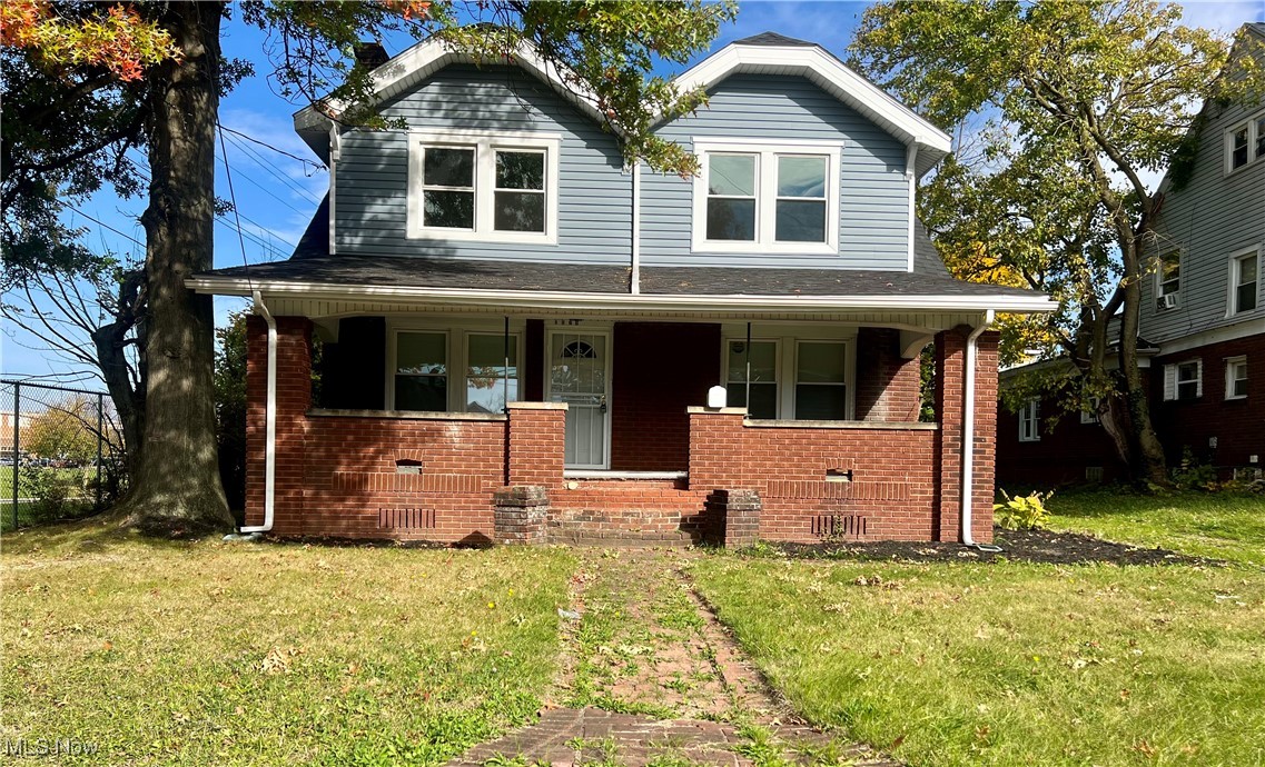 1024 Copley Road Akron, OH 44320 - Photo 1 of 31 View of front facade with a front lawn and covered porch
