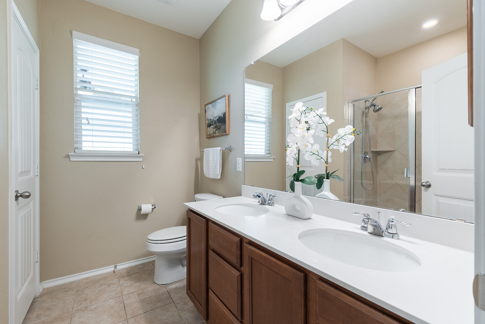 437 Sheepshank Drive Georgetown, TX 78633 - Photo 9 of 22 Dual vanities and a glass-enclosed shower create a practical and well-appointed primary bathroom with ample space for two (2) people to get ready in the morning.