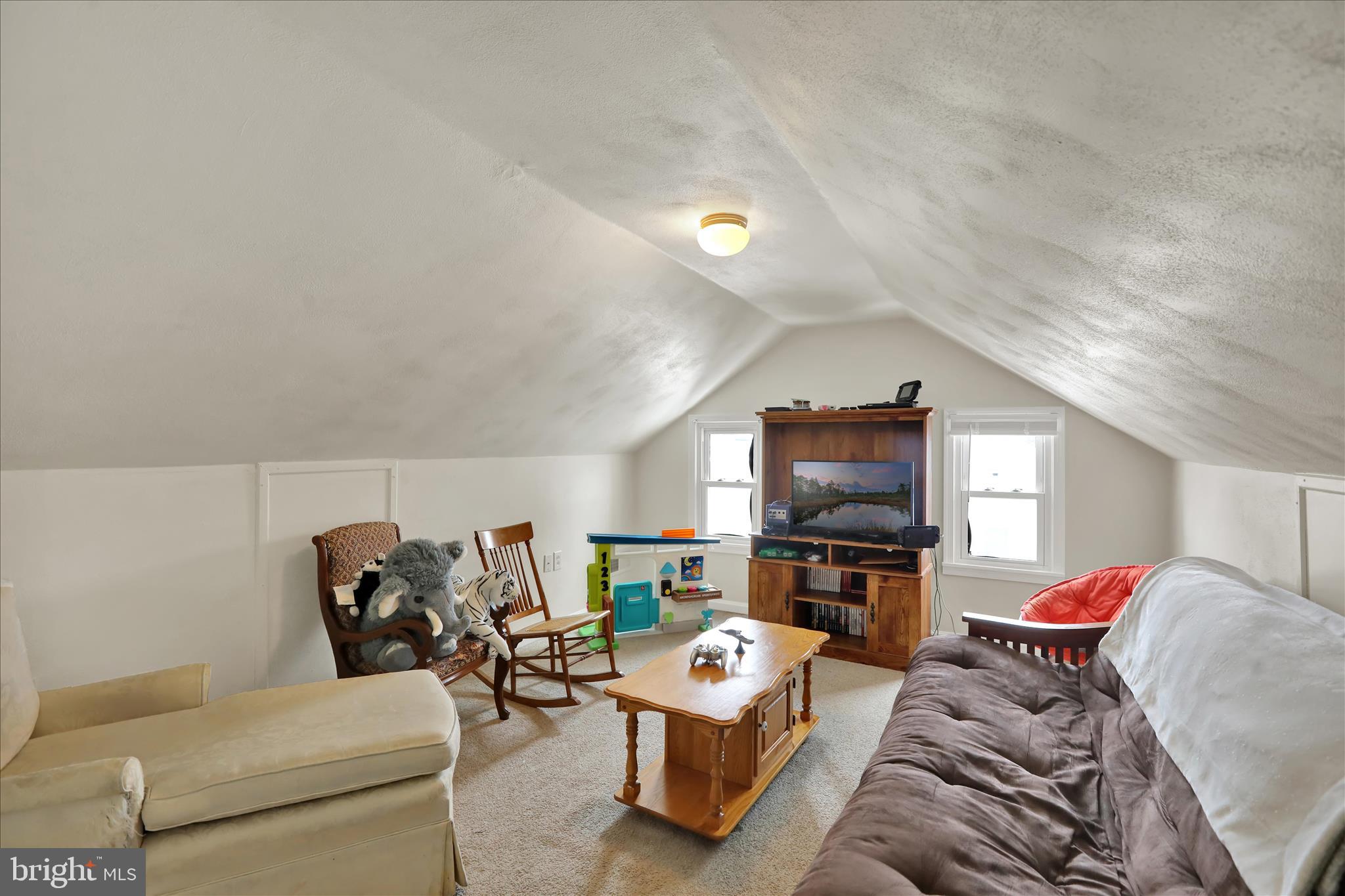 757 North Manor Road Elverson, PA 19520 - Photo 17 of 22 a living room with furniture and a flat screen tv