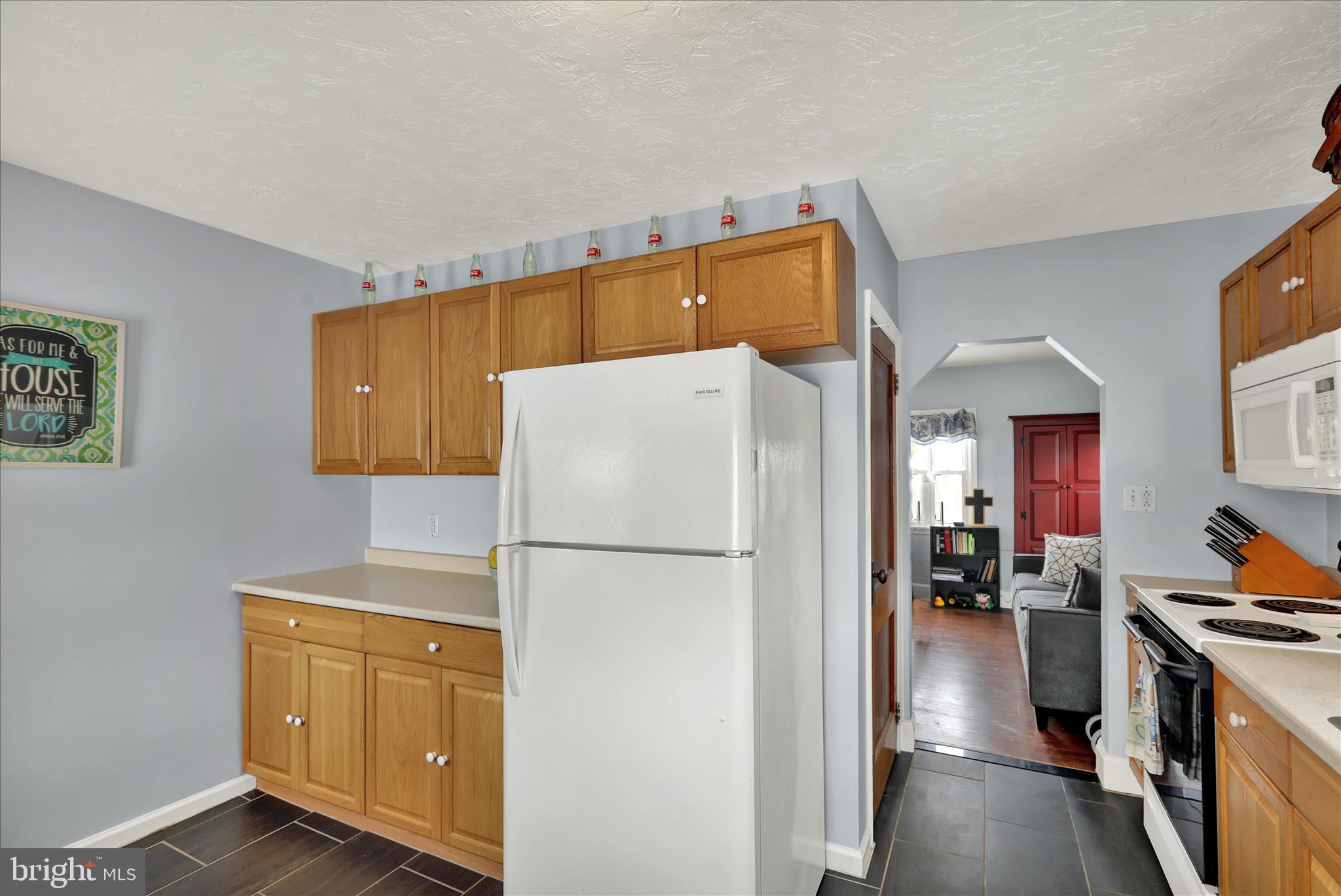 757 North Manor Road Elverson, PA 19520 - Photo 7 of 22 a kitchen with a refrigerator a stove top oven a washer and dryer