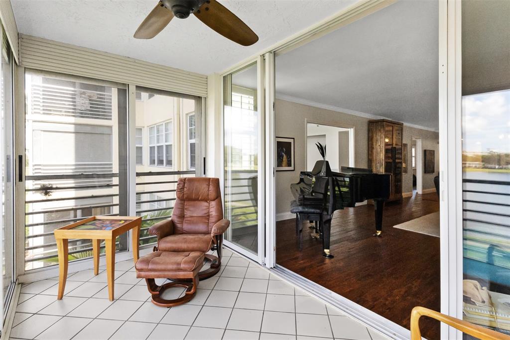 3095 North Course Drive, Unit 203 Pompano Beach, FL 33069 - Photo 13 of 49 a room with furniture