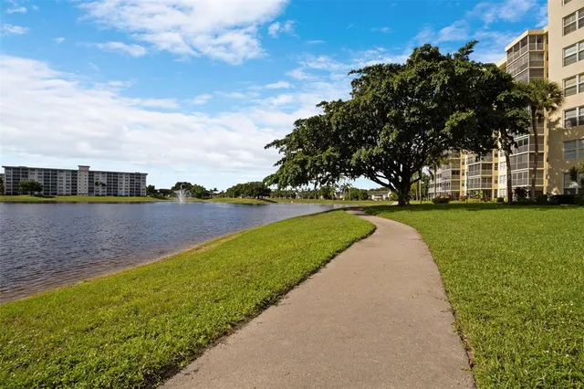 a bed room with a bed and a chandelier