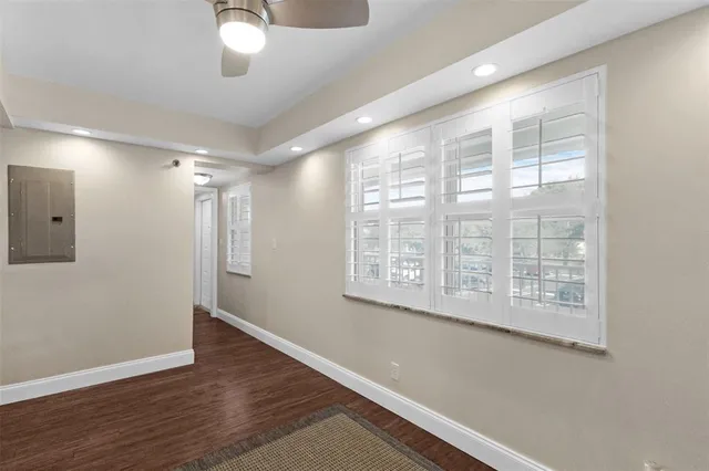 a bathroom with a sink a toilet a mirror and shower