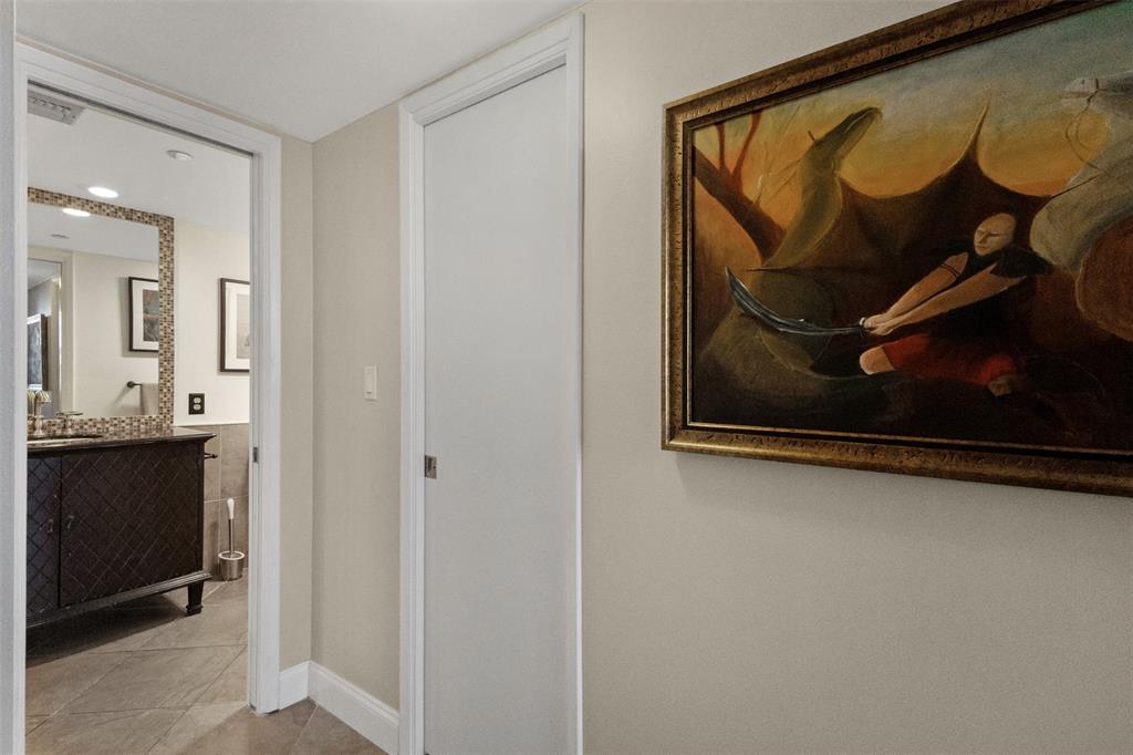 3095 North Course Drive, Unit 203 Pompano Beach, FL 33069 - Photo 25 of 49 a view of a hallway with wooden floor