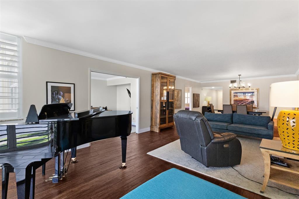 3095 North Course Drive, Unit 203 Pompano Beach, FL 33069 - Photo 3 of 49 a living room with furniture and wooden floor