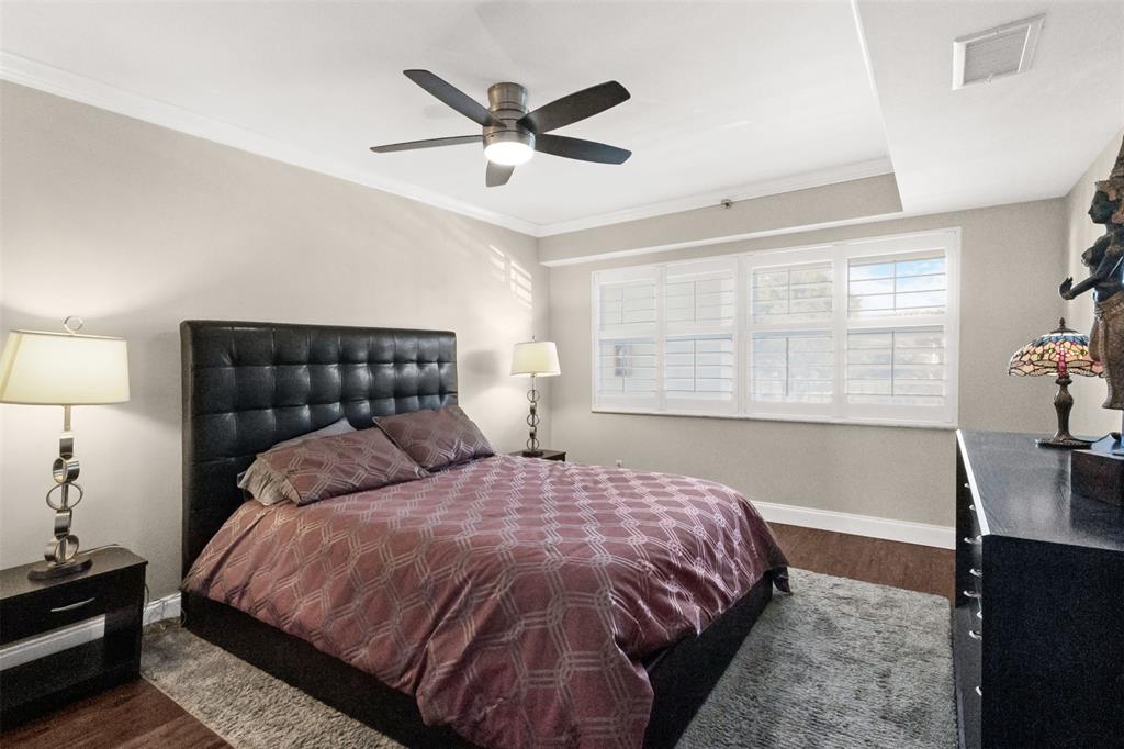 3095 North Course Drive, Unit 203 Pompano Beach, FL 33069 - Photo 33 of 49 a bedroom with a bed and a window