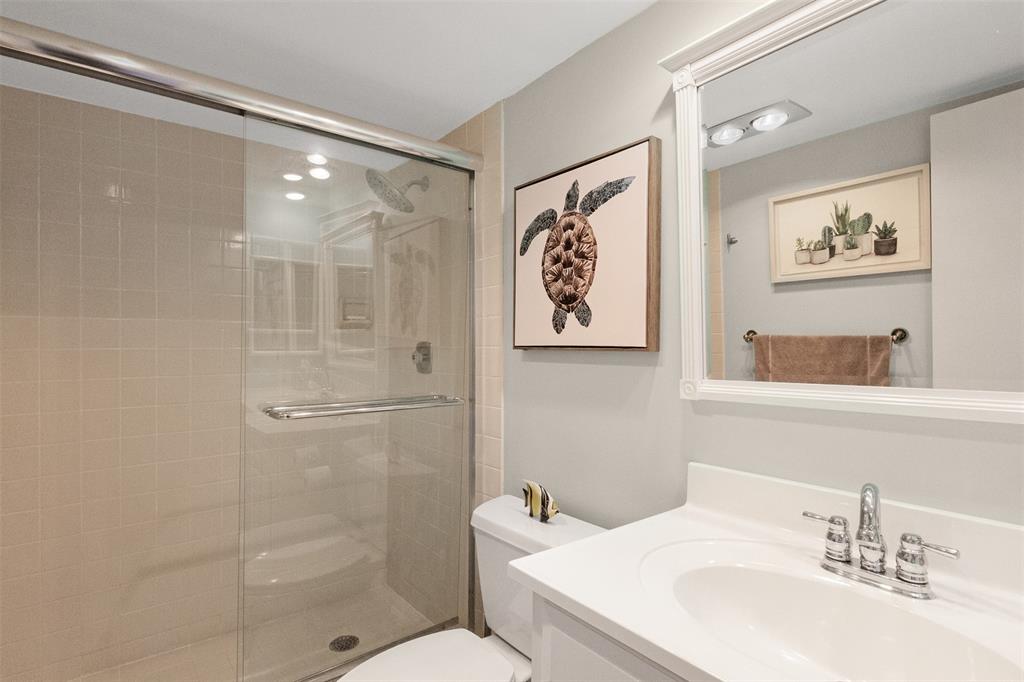 3095 North Course Drive, Unit 203 Pompano Beach, FL 33069 - Photo 37 of 49 a bathroom with a sink toilet and shower