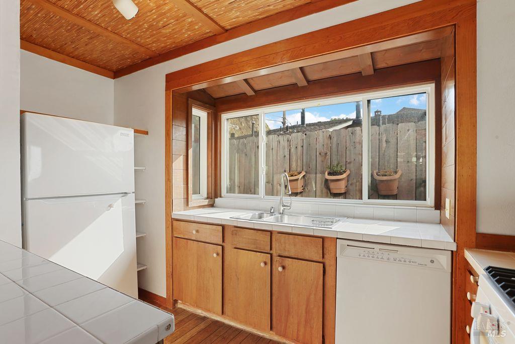 34 Sandy Beach Road Vallejo, CA 94590 - Photo 25 of 63 a bathroom with a granite countertop sink and a mirror