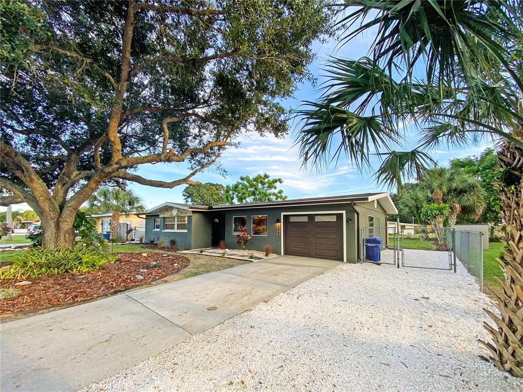208 Center Road Venice, FL 34285 - Photo 1 of 1 a house with palm tree in front of it