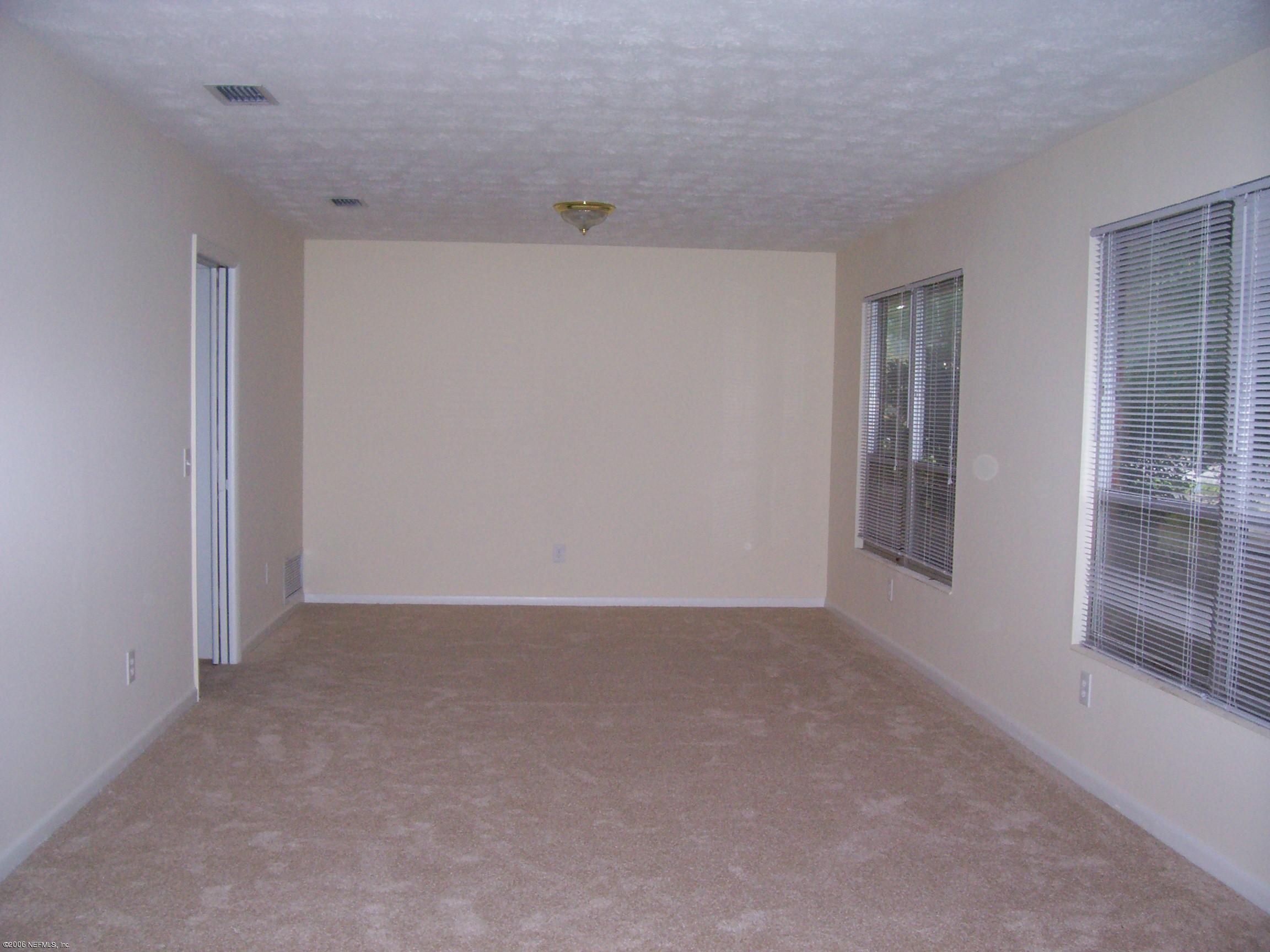 8169 Vermanth Road Jacksonville, FL 32211 - Photo 2 of 7 Living Room/Dining Room