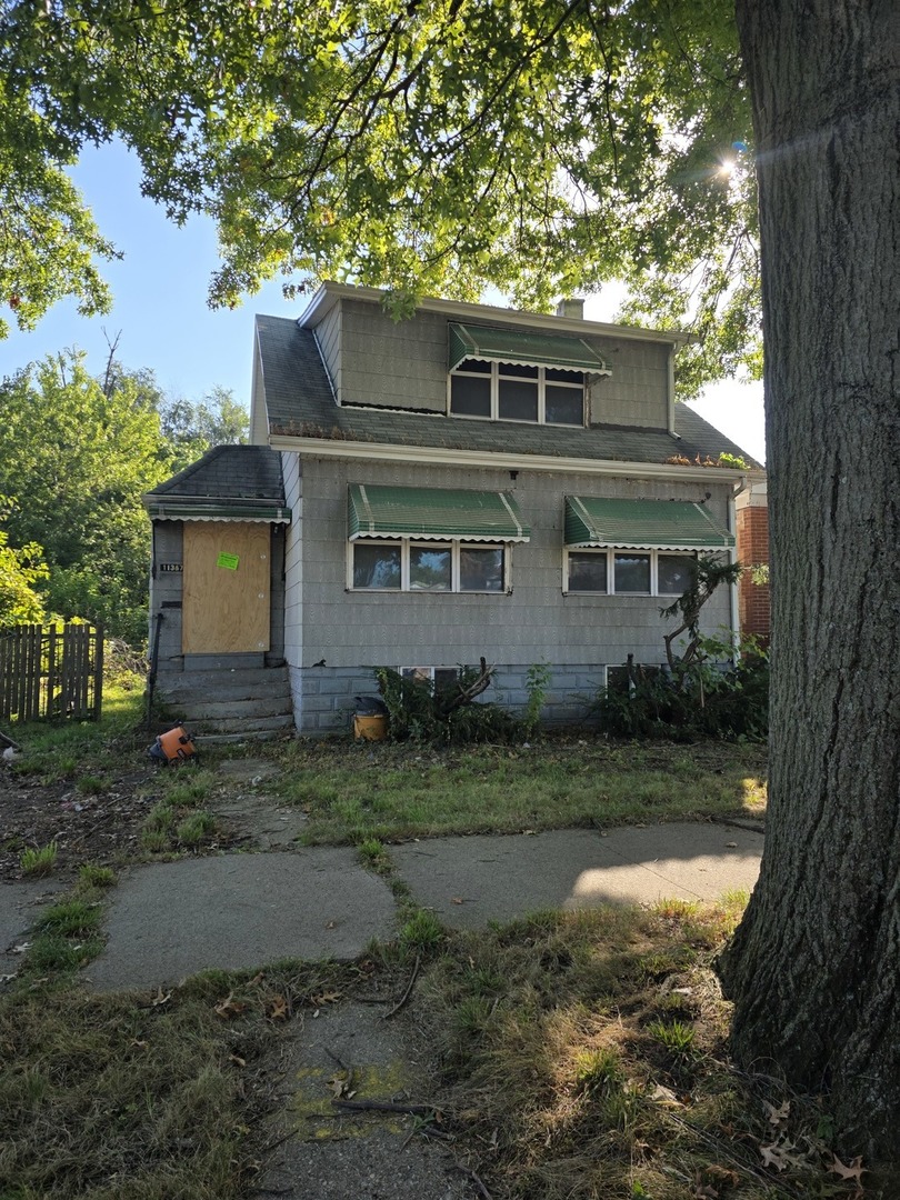11367 South Aberdeen Street Chicago, IL 60643 - Photo 2 of 20 a front view of a house with a yard and garage