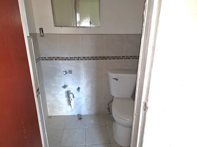 a bathroom with a toilet and a sink