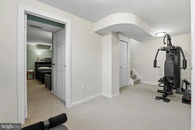 a bedroom with bed and window