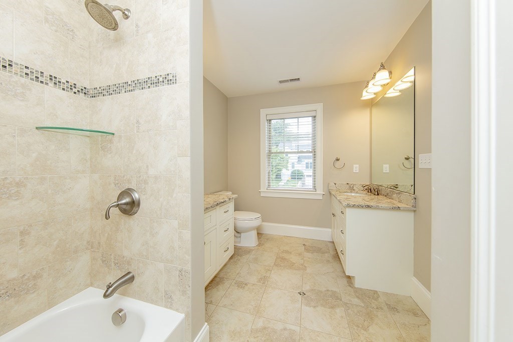 33 Liberty Avenue Lexington, MA 02420 - Photo 17 of 30 a bathroom with a bathtub and shower