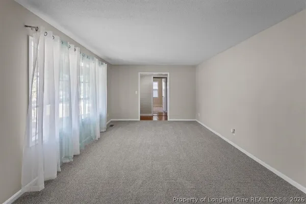 a view of an empty room with a window