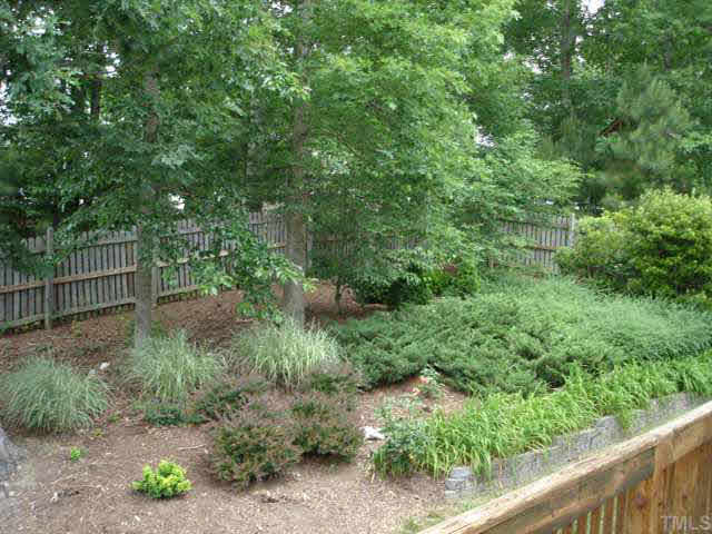 5232 Covington Bend Drive Raleigh, NC 27613 - Photo 8 of 9 Landscaped backyard