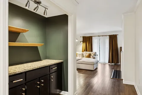 a bedroom with a bed and a mirror