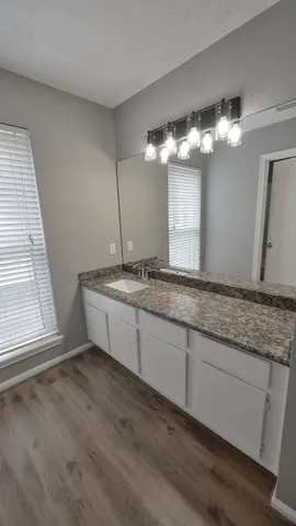 a view of balcony with wooden floor and fence