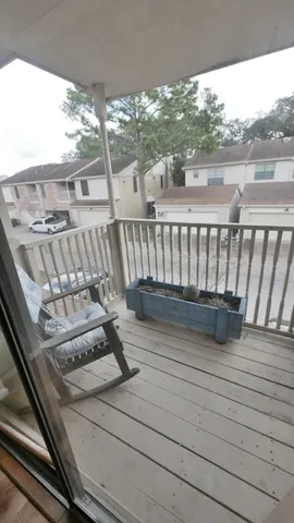 a view of a backyard with sitting area