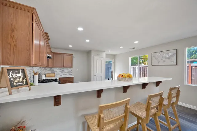 a kitchen with stainless steel appliances a sink and a counter top space