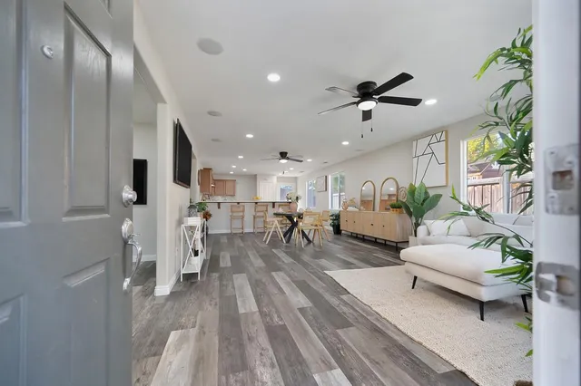 a living room with furniture and a table
