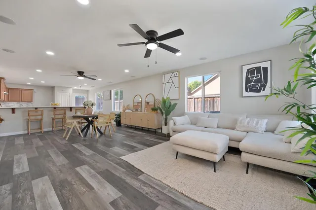 a living room with furniture and a table
