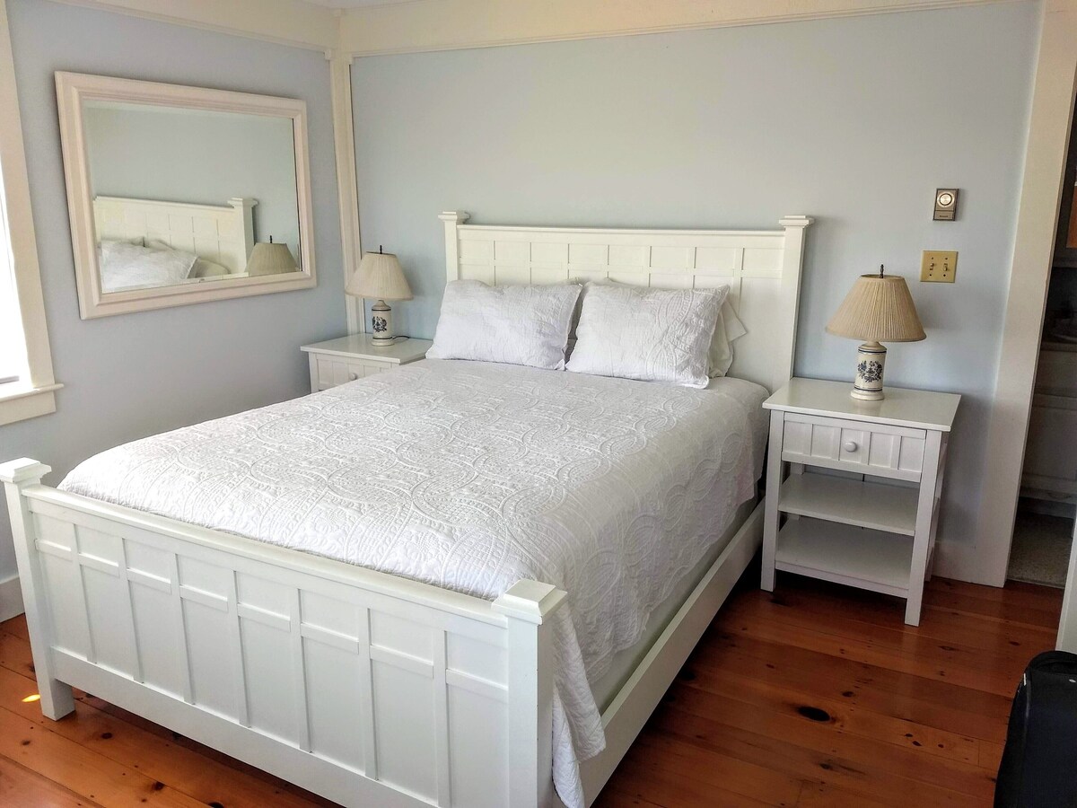 48 Madequecham Valley Road Nantucket, MA 02554 - Photo 6 of 20 a bedroom with a bed and a mirror