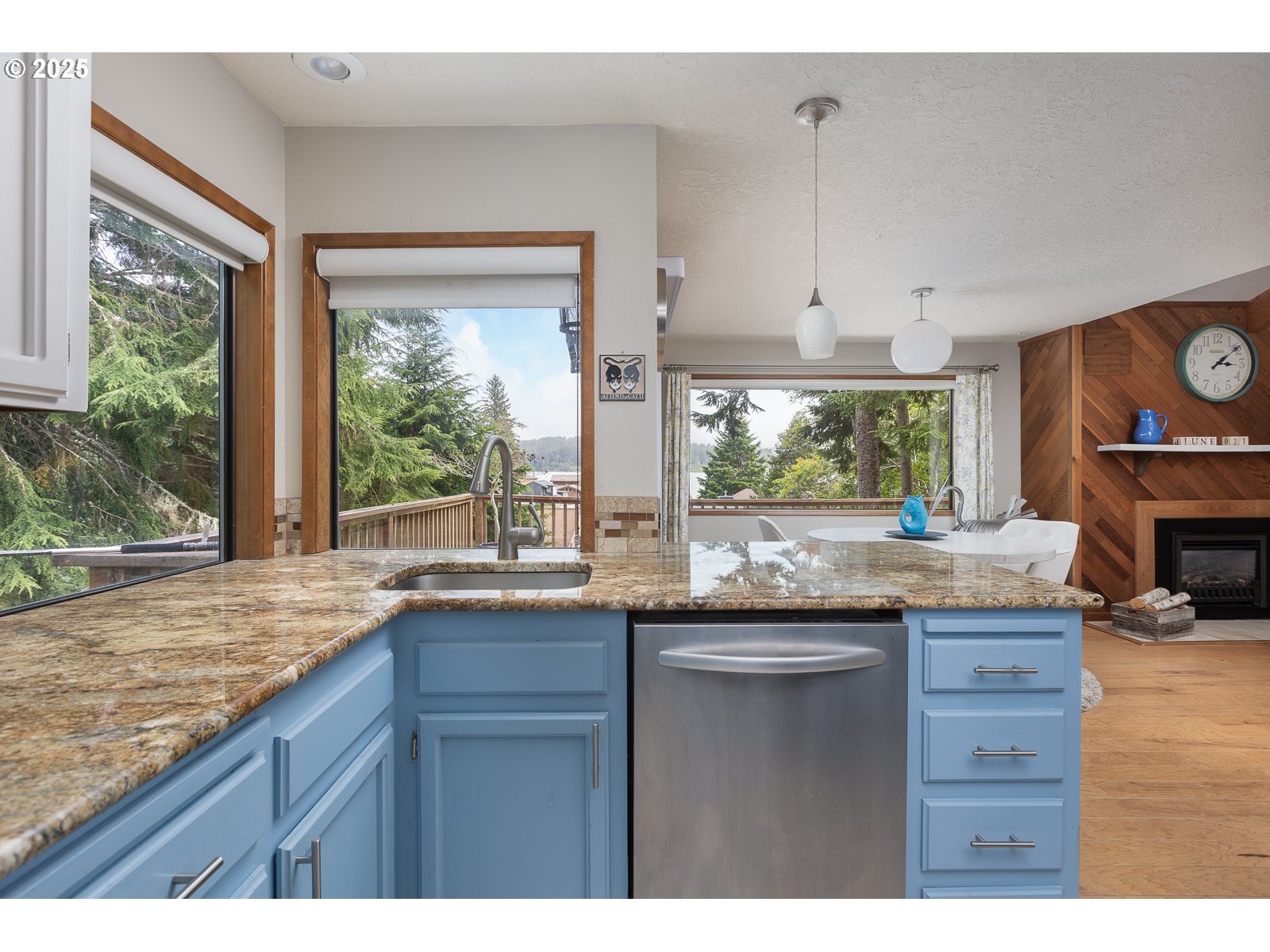 2011 Devil's Ridge Road Lincoln City, OR 97367 - Photo 17 of 24 a kitchen with granite countertop wooden cabinets and a large window