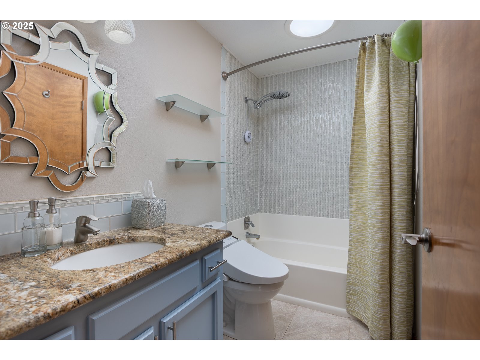 2011 Devil's Ridge Road Lincoln City, OR 97367 - Photo 19 of 24 a bathroom with a granite countertop sink toilet and shower