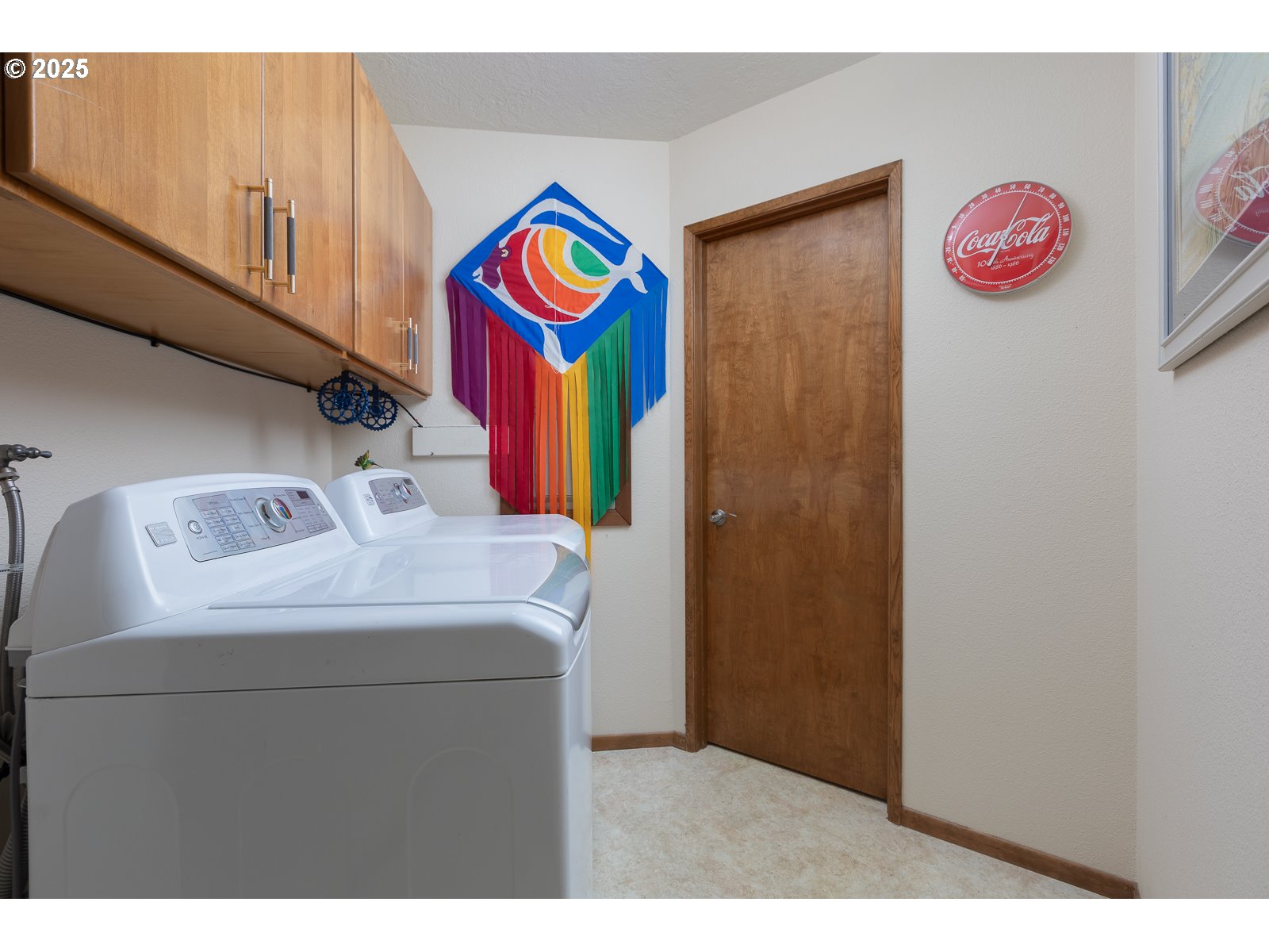 2011 Devil's Ridge Road Lincoln City, OR 97367 - Photo 23 of 24 a utility room with a refrigerator and a sink