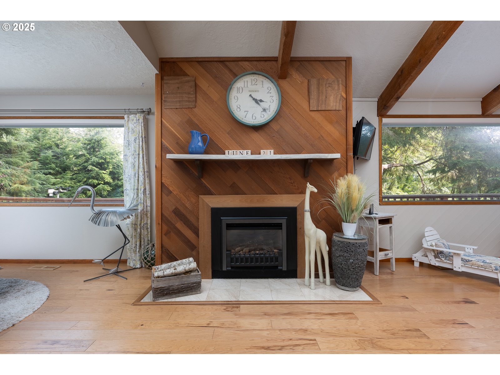 2011 Devil's Ridge Road Lincoln City, OR 97367 - Photo 4 of 24 a living room with furniture a clock and a fireplace
