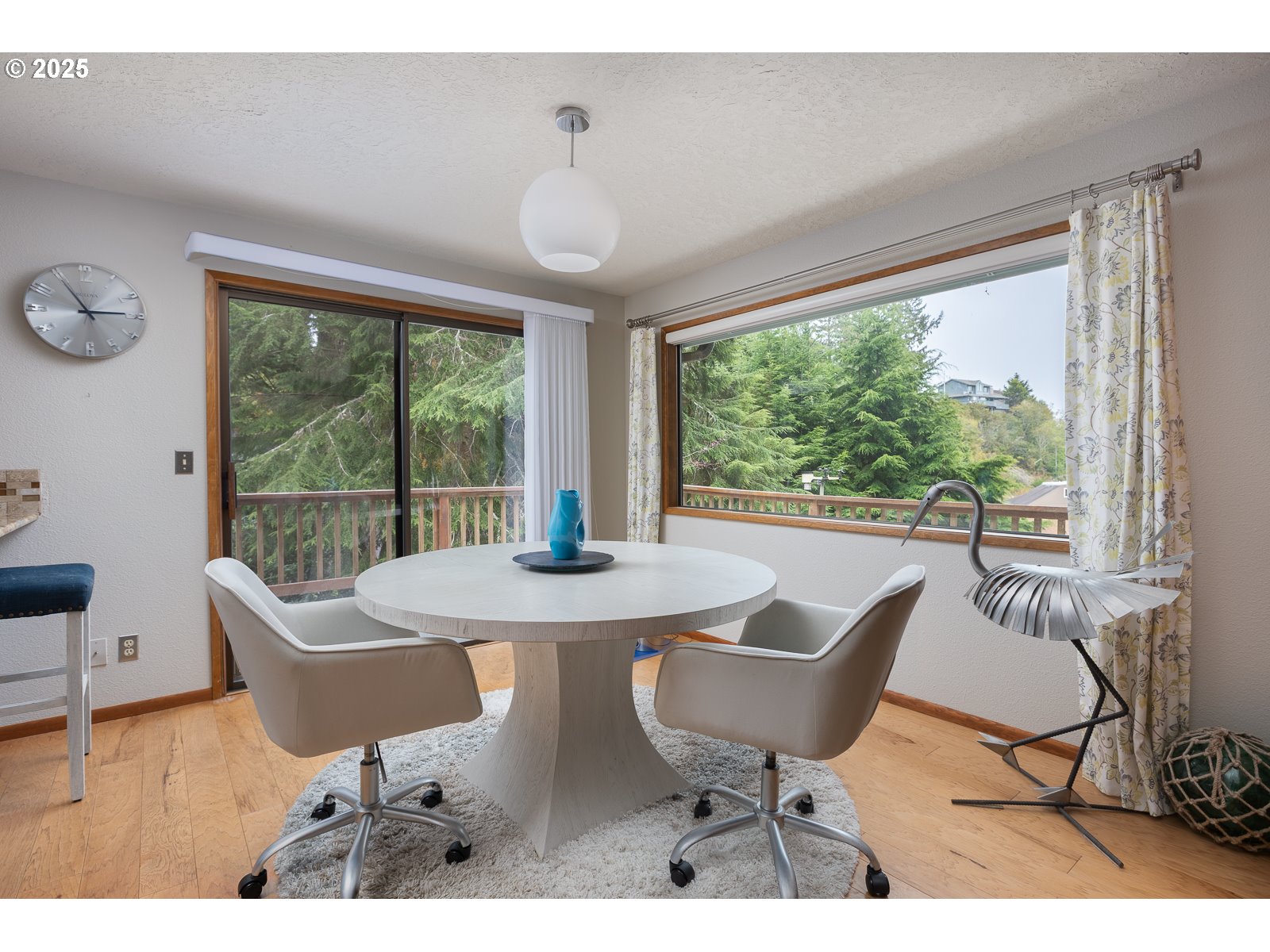 2011 Devil's Ridge Road Lincoln City, OR 97367 - Photo 5 of 24 a dining room with furniture a chandelier and wooden floor