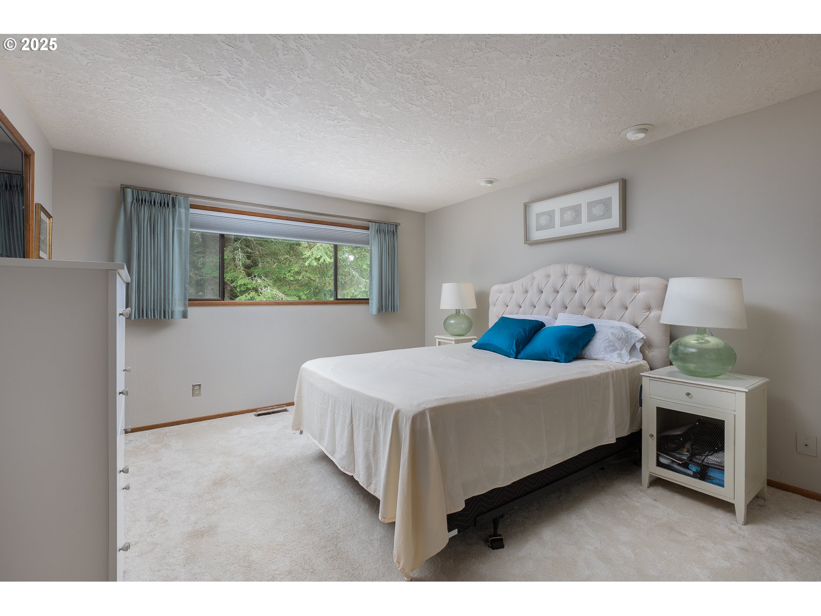 2011 Devil's Ridge Road Lincoln City, OR 97367 - Photo 8 of 24 a bedroom with a bed and a fireplace