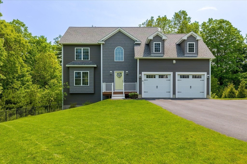 15 Tannery Road Sturbridge, MA 01518 - Photo 1 of 41 a front view of a house with a yard and garage