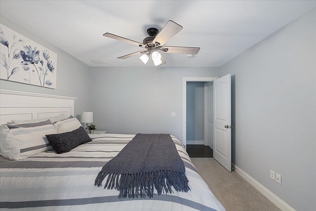 15 Tannery Road Sturbridge, MA 01518 - Photo 26 of 41 a bedroom with a bed and cabinets